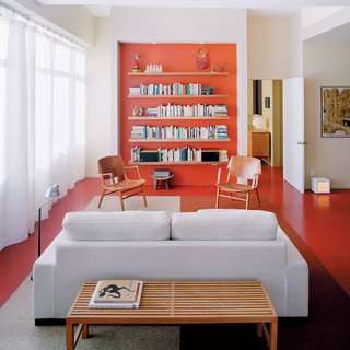 The Power of Color and What Each Shade Is Best For - Photo 7 of 11 - Architect Grant explains that the recessed orange wall with built-in storage shelving is a counterpoint to the view of Boston in the opposite direction.