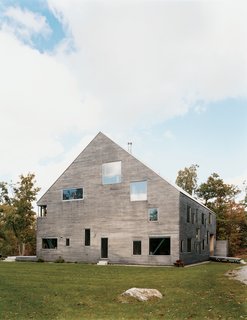 The Pine Plains, New York, home of Elise and Arnold Goodman boasts 48 windows, the largest of which measures 8'6'' by 7'6''. As architect Preston Scott Cohen explains, the "free facade makes it impossible to identify how many levels there are, or even to tell the difference between a door and a window." From without, the windows reveal dramatic glimpses of the 18th-century barn farm and new steel structure that support the house. From within, says Elise, "Each season, each time of day, offers a different view of the world. It's spectacular."