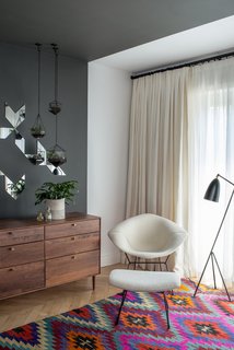 Design Icon: Greta Grossman - Photo 3 of 8 - Organic comfort meets modern functionality in the Grasshoper Lamp. In a corner of this Brooklyn Brownstone, a black Greta Grossman Grasshopper lamp sits next to a Bertoia Diamond chair with matching ottoman. Photo by Andrew Cammarano.