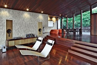 Dekleva Gregorič Arhitekti, along with resident Robert Stroj, designed most of the furnishings in the house, including the speakers, wall cabinet, and dining table. The beanbag pouffes are by Slacker Sack and the Chair-One dining chairs are by Konstantin Grcic for Magis. The stucco used on the walls was custom made from a mixture of white concrete, coral sand, dune sand, and lime.
