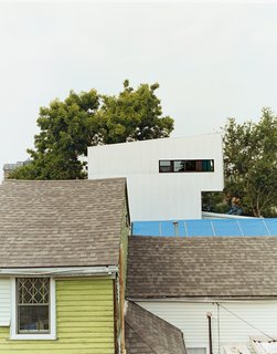 Though the Lowerline House may appear radically different, it deliberately mimics the neighboring shotgun camel-backs. The form is derived from a time when city taxes were based on the height of a building at the street front. To get more space but not get taxed, houses were built up on the rear of the property, problem solved.