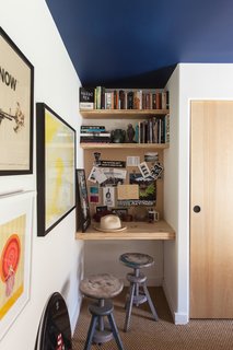 A Modern Beachside Trailer Home in Malibu - Photo 6 of 7 - The bedroom allows for a tiny niche for a built-in wood desk. The target painting is by Alia Penner.