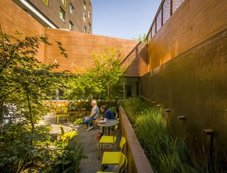 What You Need to Know When Considering Working With a Landscape Designer - Photo 2 of 6 - This outdoor space features hardy materials like concrete and weathering steel—along with Mayer/Reed-specified, drought-tolerant, and native plants and grasses.
