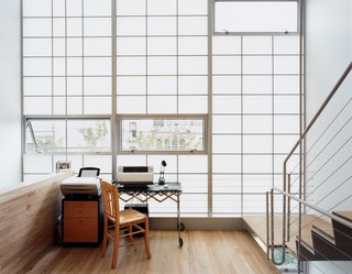 Harlem Renaissance - Photo 7 of 11 - Clear glass panes set strategically into the otherwise translucent curtain wall expose the mezzanine to fresh air and rear views.