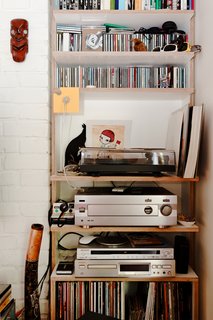 A Little Apartment Gets a Solid Renovation - Photo 6 of 8 - Much of the charm of this small, affordable space is its sense of careful clutter. The stereo, LPs, and CDs only add to the sense that this flat was designed for living, not as some airless showpiece.