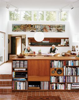 Cohen and his wife, Sally, sit in the dining room, which along with the connected living room, is a focal point of the house, lighted in part by high, remote-controlled clerestory windows.