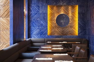 A combination of textured blue ceramic tiles inspired by Marmara marble (made by Autoban) and traditional Iznik tiles, handmade by Turkish craftsmen in Istanbul, are used in this Turkish restaurant in London.