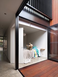 An internal courtyard anchors the house while ushering in air and light. Its materials echo those used in the rear yard. "You get a glimpse of both outdoor spaces when walking through the house," Abicic says.