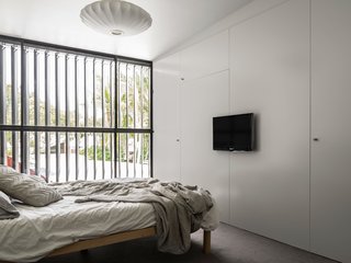 Full height louvers are used throughout the house, opening the interior spaces up to the outdoors.