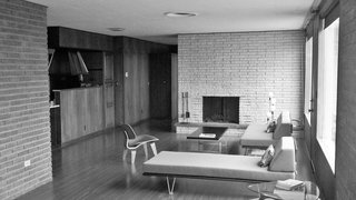 Jordan put the living room on a diet, so to speak, reducing surfaces to open the space. He removed three feet of the existing stone fireplace surround and peeled back the ceiling to reveal steel structural beams, painted a red color matched to their original hue. The house’s footprint stayed the same. "Keeping most of the existing house was the biggest ‘green’ thing we did," says Jordan. Instead of recalibrating the plan, he focused on introducing daylight, adding insulation, and replacing windows to maximize views.