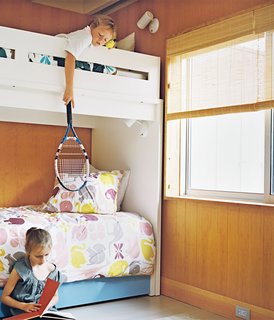 At the Fisher family’s 1960s Long Island beach bungalow, the kids share a warm, bright space with modern prints. 