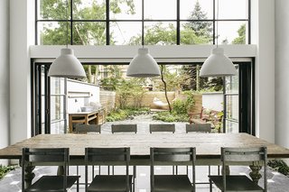 The original home’s dilapidated rear wall was in such poor condition that Roberts called it "an opportunity in disguise." She removed the wall and built a two-story addition that features double-glazed windows and sliding doors for unified entertaining inside and in the garden.
