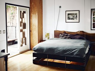The bed was designed to hang from the ceiling and can be hoisted up and pulled down as needed.