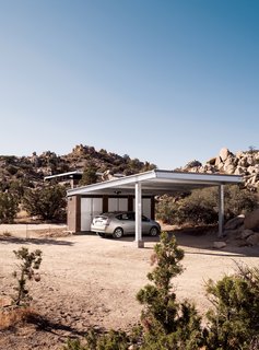 Small "Hybrid Prefab" Home in the Desert - Photo 8 of 10 - The carport stands apart from the home and is topped with Solar World’s Sun Module photovoltaic panels. McAdam and Smith have grown quite used to their small electric bills.