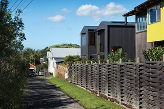 Rock the Boat - Photo 5 of 8 - With its pitched roof and verticality, the house blends with the surrounding seaside neighborhood yet remains architecturally distinct thanks to its aluminum cladding.