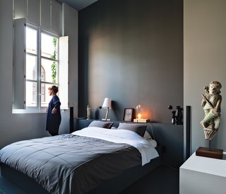 The Power of Color and What Each Shade Is Best For - Photo 5 of 11 - Wenes and Lens conceptualized a gradation of white to gray hues for the walls of the 1,500-square-foot gallery into the 4,000-square-foot home, culminating in a deep gray for the master bedroom. The room is reserved for meaningful pieces from the couple’s collection, such as a figure they found at a market in Beijing and lamps by artists Wenes represents.