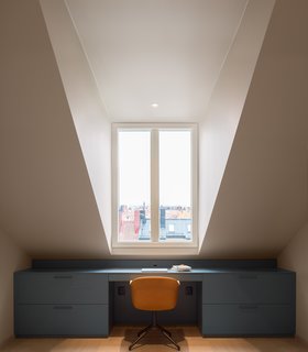 10 Essential Tips For Creating a Hardworking Home Office - Photo 7 of 10 - In one of the three upstairs bedrooms, a Muuto chair is flanked by a built-in desk with deep drawers that take advantage of the room’s distinctive angles.