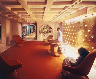 He specified many reflective surfaces, including custom brass lamps and a gold-leaf wall covered in gold globes.