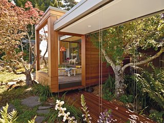 A Modern Prefab Addition to a Mid-Century California Classic - Photo 2 of 9 - The tearoom, reached by breezeways on either side, provides a transition from the main house to the pavilion, which measures 1,800 square feet. "The pavilion has a distinctive Japanese flair to it, like the original house," says Parco.