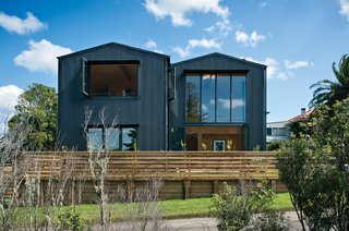 Rock the Boat - Photo 4 of 8 - The exterior of the Popadich residence is modeled after boat storage sheds, while the interior is outfitted with industrial concrete and ply.