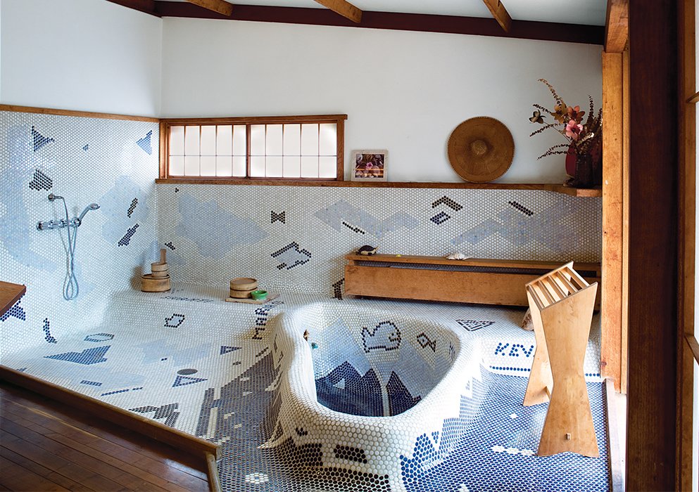 The sunken bathtub in George Nakashima’s Sanso Villa mimics the shape of a swimming pool on the grounds. His daughter, Mira Nakashima, took over the studio after his death and now lives and works on the property.