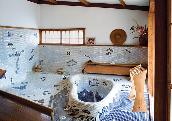 The sunken bathtub in George Nakashima’s Sanso Villa mimics the shape of a swimming pool on the grounds. His daughter, Mira Nakashima, took over the studio after his death and now lives and works on the property.