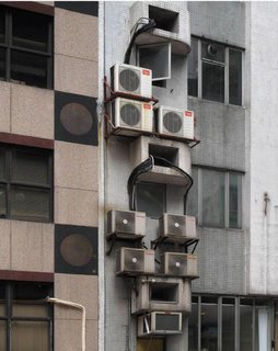 An exterior detail shows a jumble of air-conditioning units. Photo by Michael Wolf, courtesy of the Flowers Gallery.