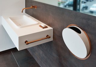 10 Ideas For the Minimalist Bathroom of Your Dreams - Photo 9 of 10 - Arne Jacobsen designed these fixtures for Vola in 1968. In 2014, the Danish company added a deep copper finish to the line. Shown here is the 112 faucet and mixer series and the round series in-wall accessories.