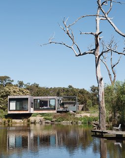 14 Totally Off-the-Grid Cabins - Photo 8 of 14 - Perched above a lake on Australia’s verdant Mornington Peninsula, James and Imogen Tutton’s teak-clad house was designed by Karen Alcock of Melbourne-based MA Architects.