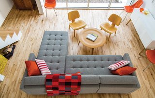 A Versatile House Fulfills All This Musician's Needs - Photo 3 of 11 - A Dual Pebble tufted sectional sofa by Gus Design Group for CB2 is the focal point of the living space. The maple floors are composed of inexpensive "shorts" left over from other projects and sold at a discount.