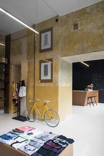 A Design Boutique Opens in Poland - Photo 3 of 7 - The ochre concrete walls have a deliberately rough quality to them. Photo by Anna Domańska.