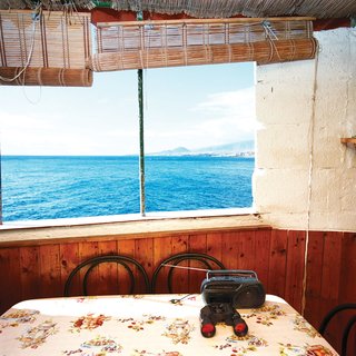 6 Modern Homes on the Water - Photo 6 of 6 - As a result of this cave dwelling on Spain's Canary Islands being so close to the seemingly endless blue water, it has a distinctly no-frills vibe—but it’s hard to argue with the view. Photo by Gunnar Knechtel.