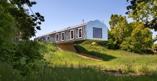 On the edge of a nature reserve a few miles from the Suffolk coast, the MVRDV-designed Balancing Barn cantilevers over the surrounding meadow.