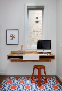 10 Essential Tips For Creating a Hardworking Home Office - Photo 1 of 10 - A Mash Studio Wall-Mounted desk offers a place to study. The rug is from One King’s Lane and a SoCo Modern Socket pendant illuminates the room.