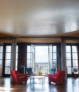 In this grand Parisian apartment, the Zig Zag (far right) makes for a one-of-a-kind book storage solution.