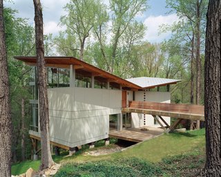Designed by Frank Harmon this residence features deep roof overhangs shade the interior from high summer sun.