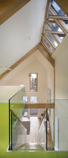 The Lighthouse lives up to its name, filled with natural daylight from floor to double-height ceiling. Light wood, white walls, and plenty of glass help keep the place bright.