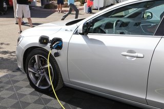 Dwell Media and Volvo Cars Bring The Future of Mobility to Palm Springs Modernism Week 2014 - Photo 4 of 11 - Hundreds of people flocked to the Pure Tension Solar Pavilion and V60 Plug-in Hybrid. The solar canopy (the only prototype of its kind) fits in the back of the V60 and can recharge the car battering in 10-12 hours. The V60 is a diesel hybrid, which offers a lower CO2 emission rating or a pure electric power option. Flooring provided by SwissTrax.