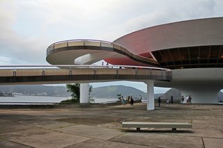 Known for his futuristic concrete designs that seem to outwit gravity throughout Brazil, Brazilian architect Oscar Niemeyer described his Niterói Contemporary Art Museum in Rio de Janeiro as "a flower that rises from the rock." The organic, saucer-like structure uses concrete to form everything from the main building and its snaking walkway to the benches outside.