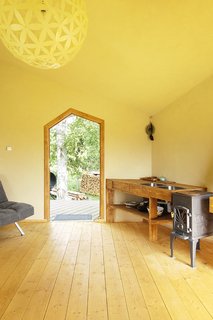 The interior of Jaanus Orgusaar's NOA cabin in the Virumaa region of Estonia. The walls were first plastered with limestone paste, then painted with cottage-cheese paint.