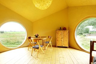The interior of Jaanus Orgusaar's NOA cabin in the Virumaa region of Estonia. The wide windows provide a great view of the surroundings.