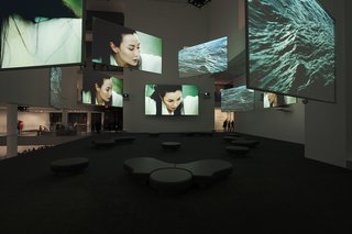 Ten Thousand Waves, the nine-screen installation by Isaac Julien, pictured here while on display at the Museum of Modern Art, will be part of MOCAA’s permanent collection and be featured in MOCAA’s atrium. Other highlights include pieces from Africans from all over the continent and the diaspora, including work by Kudzanai Chiurai, Nandipha Mntambo, Edson Chagas, and Zanele Muholi. Mark Coetzee, the collection’s curator, is originally from South Africa and says building a contemporary art museum in Africa is a dream come true. "I’ve always wanted to do this since I was a kid," Coetzee says. "Normally collectors collect what they collect, and at a certain point, they say ‘Let’s start a museum,’" he says. By contrast, Jochen Zeitz gave Coetzee the go-ahead to build a collection with the scale and ambition for a museum from the outset.<br><br>Photo courtesy: Isaac Julien