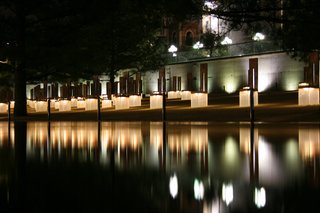 5. Oklahoma City National Memorial & Museum (Oklahoma City, United States): Designed by Hans and Torrey Butzer with Sven Berg<br><br>A grid of illuminated glass-and-bronze chairs, laid out in rows to represent which floors of the Alfred P. Murrah Federal Building each victim was during the bombing, light up at night, becoming beacons of hope. Two gates mark the edges of plaza and memorial; the 9:01 Gate (the last moment of innocence) and the 9:03 Gate (the start of the healing process). Photo by Jimx.