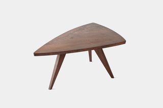 Impressed by the simple elegance and understated forms of his work, Hans and Florence Knoll added Nakashima’s work to their roster. This table was designed in 1946 with a low-sheen finish and live grain patterns.