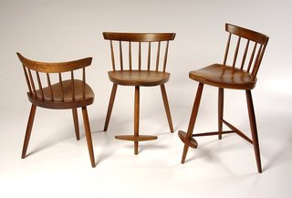 These three-legged chairs were designed in 1950 for George’s daughter, Mira, who now runs George Nakashima Woodworker, the company that carries on the Nakashima legacy.