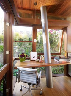 Materials and craft play a significant role inside and out. The columns are Type 316 stainless steel – almost nautical grade. Floors and walls are walnut; windows are mahogany.