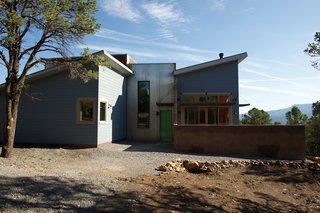 The exterior is constructed of corrugated steel and fiber-cement siding by Hardie Boad. The use of these fire-retardant materials gave the couple a break on the insurance premiums that they pay to live in this area of Colorado's San Juan Mountains, where wildfires have been known to break out. Photo by Barry B. Doyle.