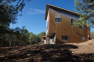 The corrugated steel that was chosen for the exterior was designed to weather over time. A rust-hued patina is already taking hold. Photo by Barry B. Doyle.