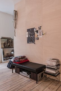 Freunde von Freunden and Vitra’s Berlin Apartment - Photo 3 of 9 - Salon of the Freunde von Freunden X Vitra ApartmentUnable to remove the center wall, architect Etienne Descloux instead created a wood-paneled centerpiece for the apartment.Photo by Steve Herud