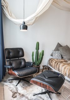 Freunde von Freunden and Vitra’s Berlin Apartment - Photo 4 of 9 - Salon of the Freunde von Freunden X Vitra ApartmentTented fabric provides separation for the bedroom, and plays off the room's array of textures.Photo by Steve Herud